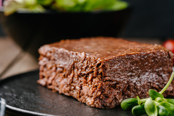 Raw vegetable vegan mince pate on wooden table close-up. Copy space