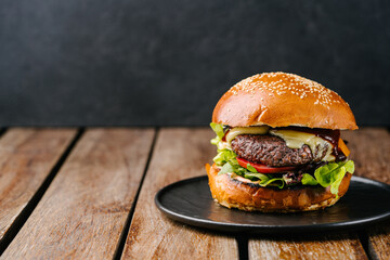fresh tasty meat free burger on wooden table. Copy space - obrazy, fototapety, plakaty