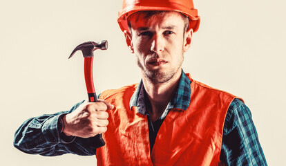 Man builder isolated on white background. Hammer hammering. Builder in helmet, hammer, handyman,...