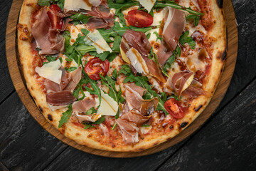 Italian pizza on a dark table
