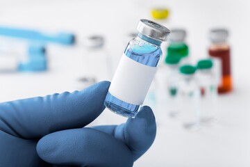 The nurse holding Covid19 vaccine in hand