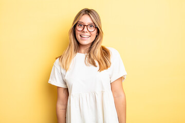 blonde pretty woman with a big, friendly, carefree smile, looking positive, relaxed and happy,...