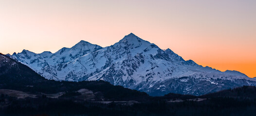 Plakat Mount Tetnuldi rises above the Great Caucasian Range in the upper Svaneti. Georgia
