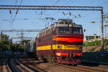 A passenger train moving on the tracks near the station Rostov-Main