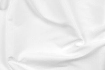 Fototapeta premium Abstract white fabric texture background. Cloth soft wave. Creases of satin, silk, and cotton. 