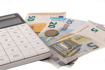 money, euro, white calculator. the concept of buying and maintaining a house, apartment, credit relations, loan