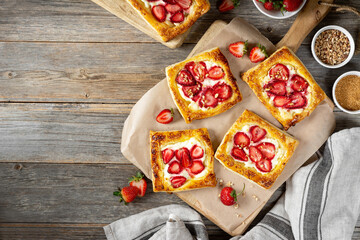 Puffs with cheese cream and strawberries. Delicious homemade sweet pastries	
