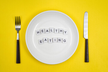 Conceptual photo, table setting with an empty plate, with one of the principles of healthy living - 