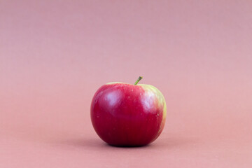Red fresh apple on brown background
