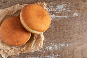 Chocolate beignets on rustic background