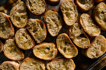 beautiful view of slices of delicious bread baguette on a tray