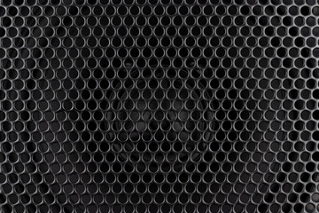 Stylish car audio acoustic round speaker with waffle grill protector cover closeup. Modern music black background texture - Powered by Adobe