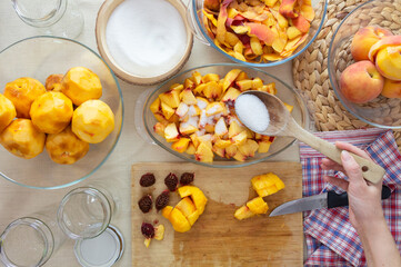 making peach jam on the table, making peach compote
