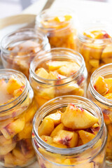 making peach jam on the table, making peach compote