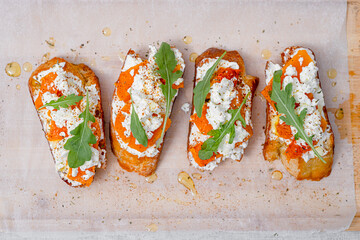grilled ciabatta bruschetta with baked pumpkin, feta arugula and spices. healthy fall baked pumpkin...