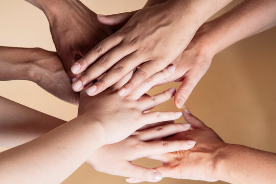 many hands of multi-ethnic women of different skin color