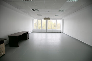 Empty white room with light walls.