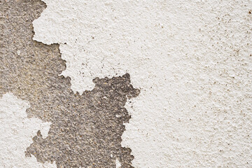 Abstract old white concrete wall with peeling paint