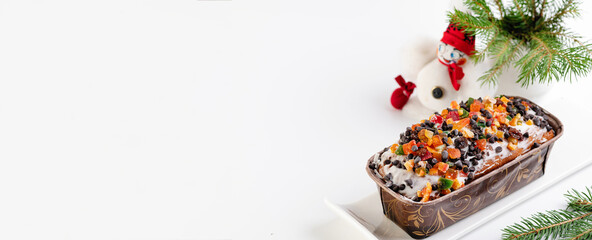 italian christmas cupcake with fir branches and snowman on white background, banner, empty space for text