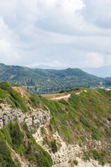 Naklejka premium A hilly landscape near a small village