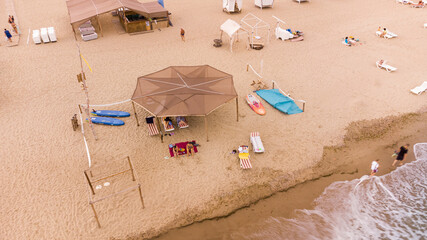 Zatoka, Odessa, Ukraine - September 1, 2021: People rest and sunbathe on the Black Sea beach, drone view