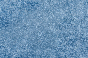 Air bubbles in thin ice, abstract background