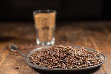 Black coffee beans in bowl, coffee concept still life