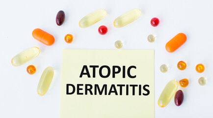 On the card text ATOPIC DERMATITIS, next to the multi-colored capsules.