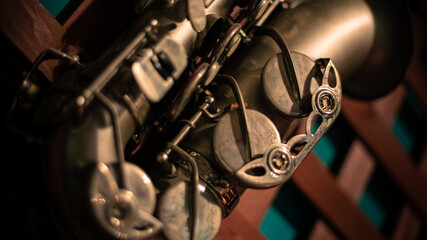 Naklejka na ściany i meble Close up of old tenor saxophone in vintage look. Golden sax musical instrument