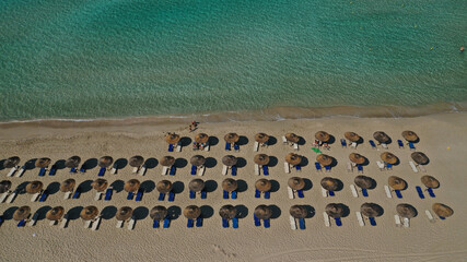 Aerial drone photo of paradise turquoise sandy beach and bay of Simos in island of Elafonisos visited by yachts and sail boats, South Peloponnese, Lakonia, Greece
