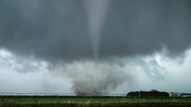 A Tornado Churns In A Field During An Outbreak Of Severe Storms