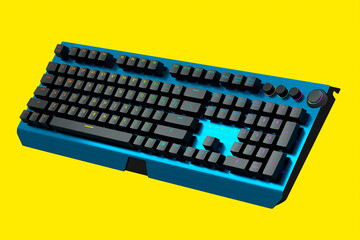 Blue computer keyboard with rgb colors isolated on yellow background.