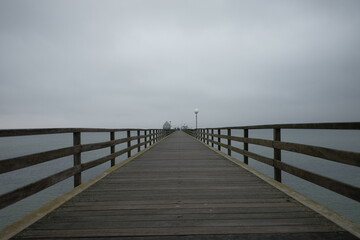Fototapeta na wymiar wooden bridge over water