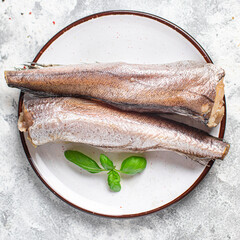 hake raw fish white fillet seafood fresh ready to eat meal snack on the table copy space food...