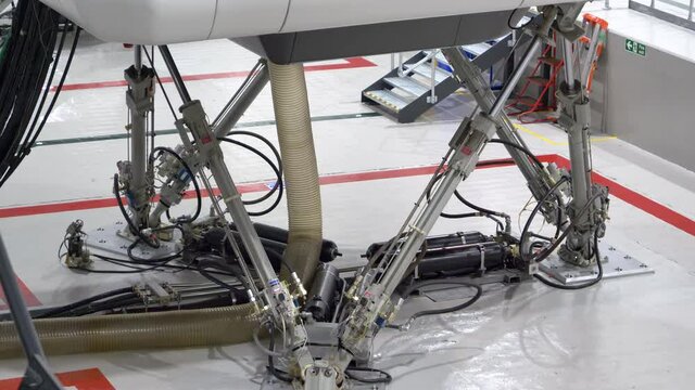 Detail Electric Hydraulic System Beneath Full Motion Flight Simulator.