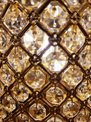 Abstract glowing chrystal chandelier close-up. Glamour background.