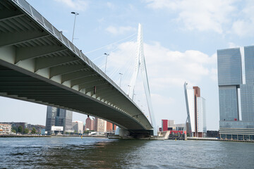 View from under Erasmus Bridge across New Meuse River to business district buildings