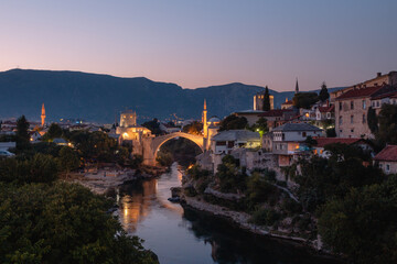 Fototapeta na wymiar Mostar Bridge - Stari Most seen in the evening in summer, famous touristic destination in Bosnia and Herzegovina, Europe