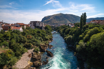 View over Neretva river during a sunny day in Mostar, touristic destination in Bosnia and...