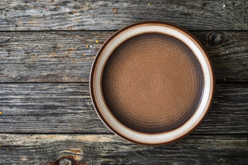 Empty plate on wooden table
