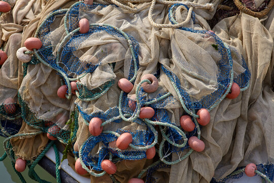 Close up of a Fishing Net with float line attached to small plastic floats