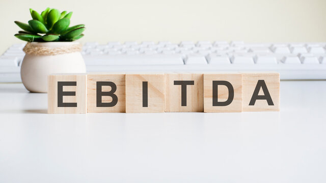 ebitda word made with building blocks isolated on white