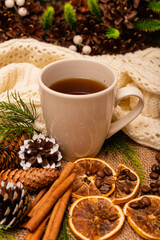 
Beautiful stylish christmas composition with a cup of tea, cinnamon and pine cones
