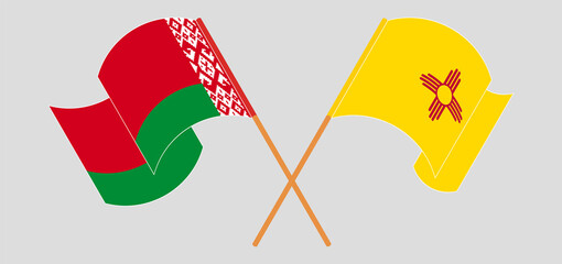 Crossed and waving flags of Belarus and the State of New Mexico
