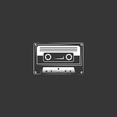 An icon of an old audio cassette in vintage style on a black background. Vector illustration.