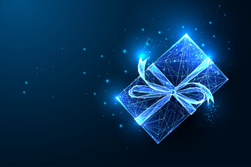 Christmas glowing gift box with ribbon bow and stars isolated on dark blue background