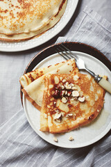 French crepes with honey and hazelnuts.