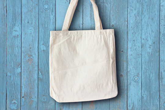 white fabric bag hanging on the blue wall mocap