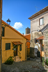 Fototapeta premium A narrow street in Nemi, a medieval town overlooking a lake in the province of Rome, Italy.