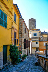 A narrow street in Nemi, a medieval town overlooking a lake in the province of Rome, Italy.